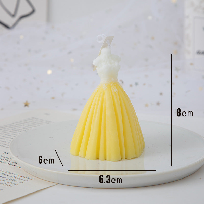 Beautiful yellow wedding candles shaped like a dress, perfect for elegant table decor