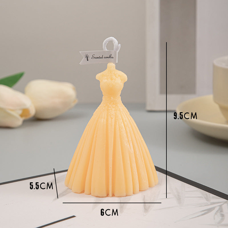Elegant yellow wedding candles shaped like a bridal gown, perfect for wedding decor