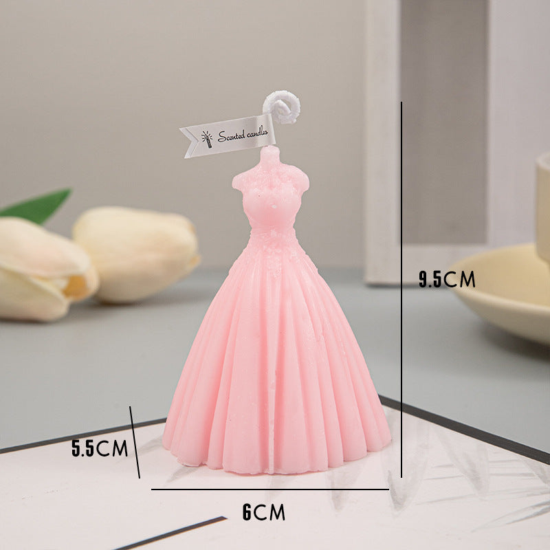 Pink dress-shaped wedding candles by Arts And More, perfect for elegant wedding decorations