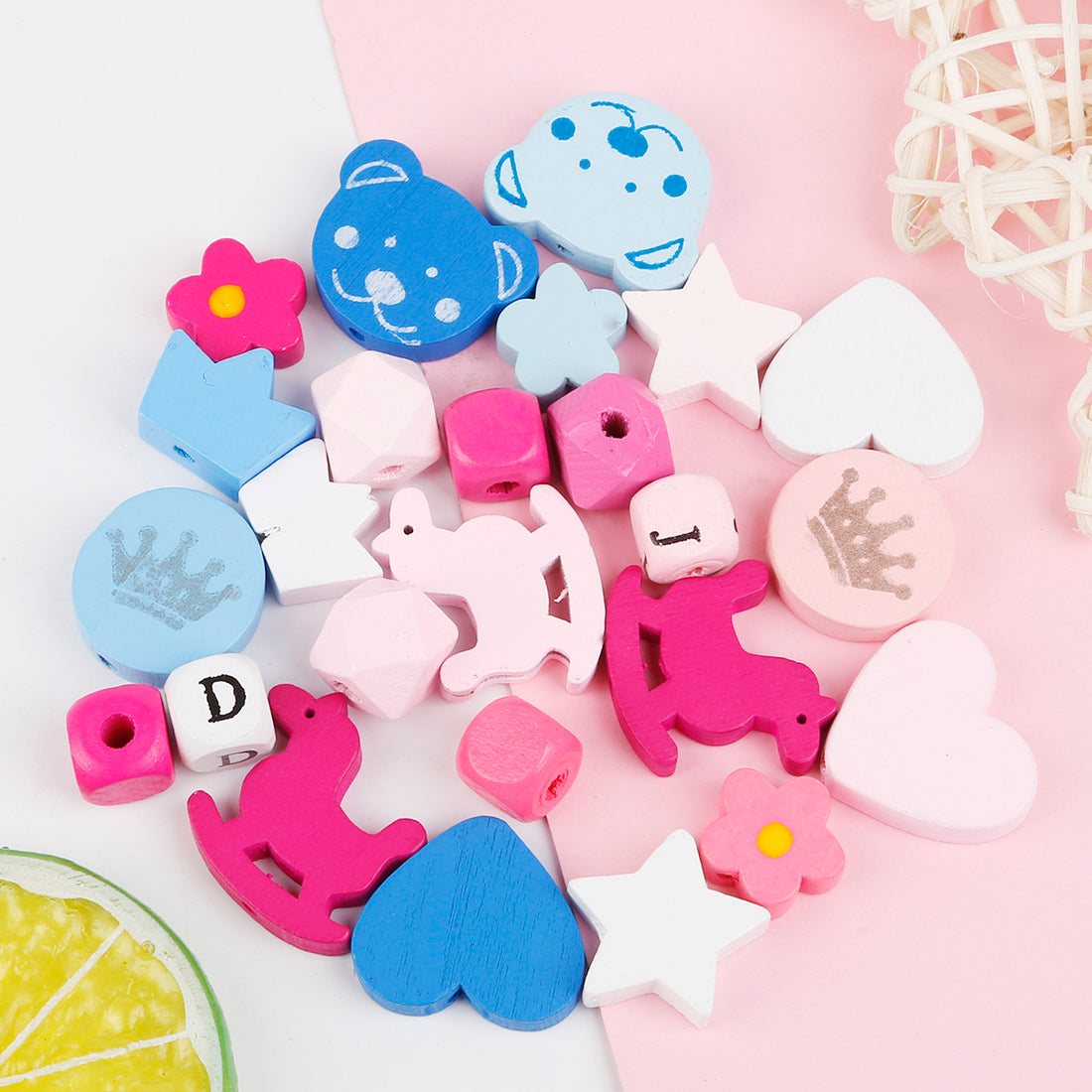 Colorful beaded materials including hearts stars animals and flowers for craft projects