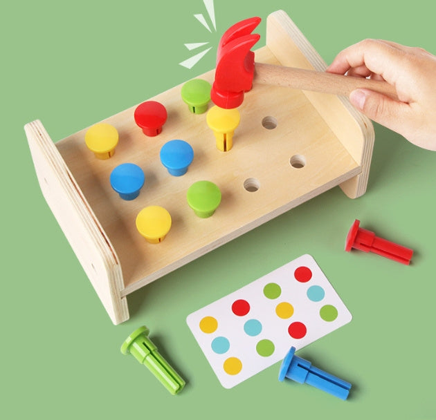 Arts And More Kids DIY Kits wooden puzzle toy with colorful pegs and small hammer on green background