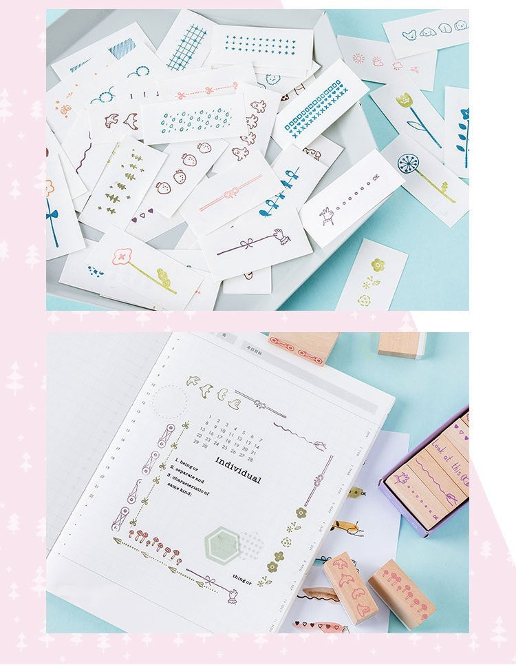 Assorted craft papers and wooden stamps from the Wooden Stamp Suit by Arts And More for creative projects