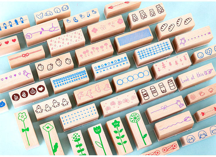 Arts And More Wooden Stamp Suit featuring various colorful wooden craft stamps with flowers, shapes, and patterns