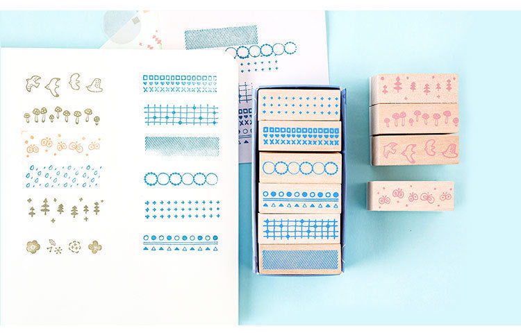 Arts And More Wooden Stamp Suit with various nature and pattern designs on blue background